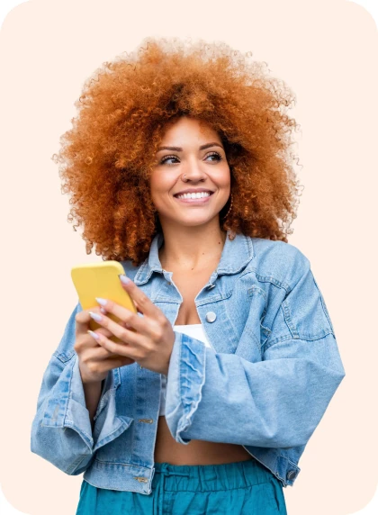 Smiling woman with curly hair holding a yellow phone